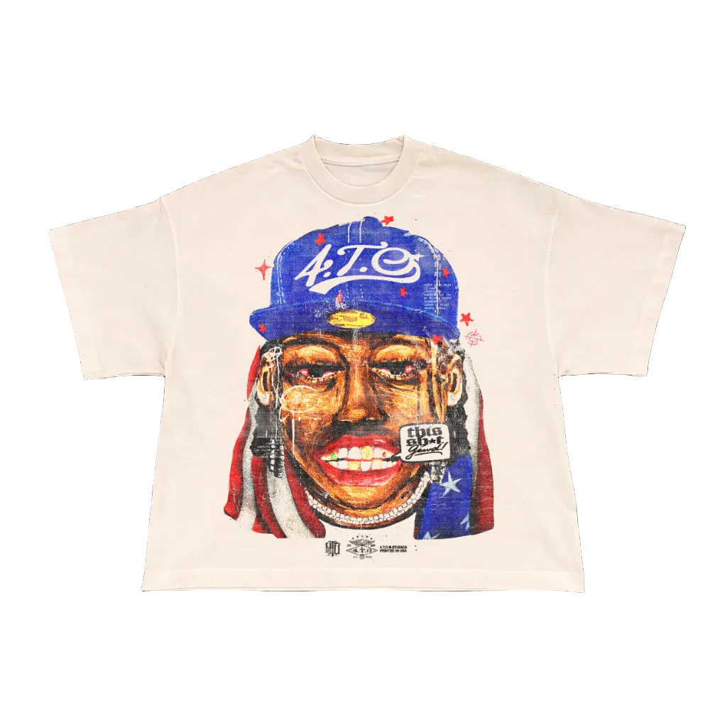 T-shirt with a graphic of a person wearing a blue cap and red headband on a beige background